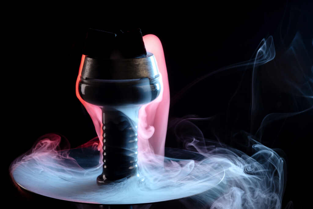 a hookah with smoke coming out of it