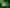 a group of glass bongs on a green surface