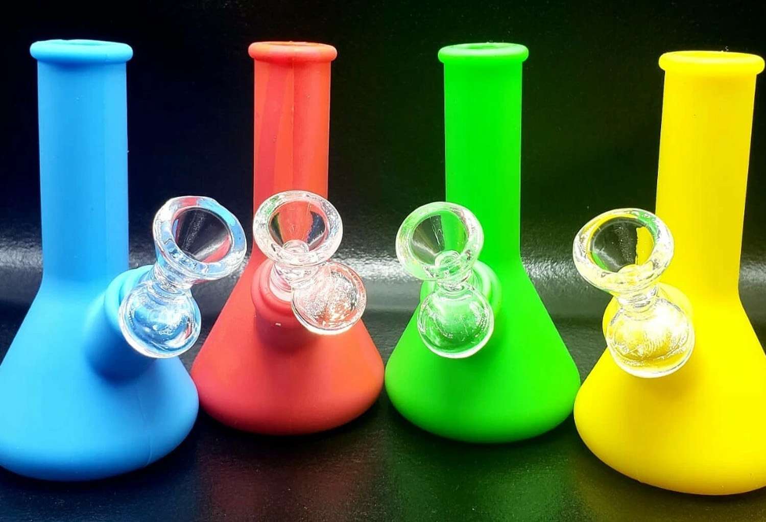 a group of colorful bongs